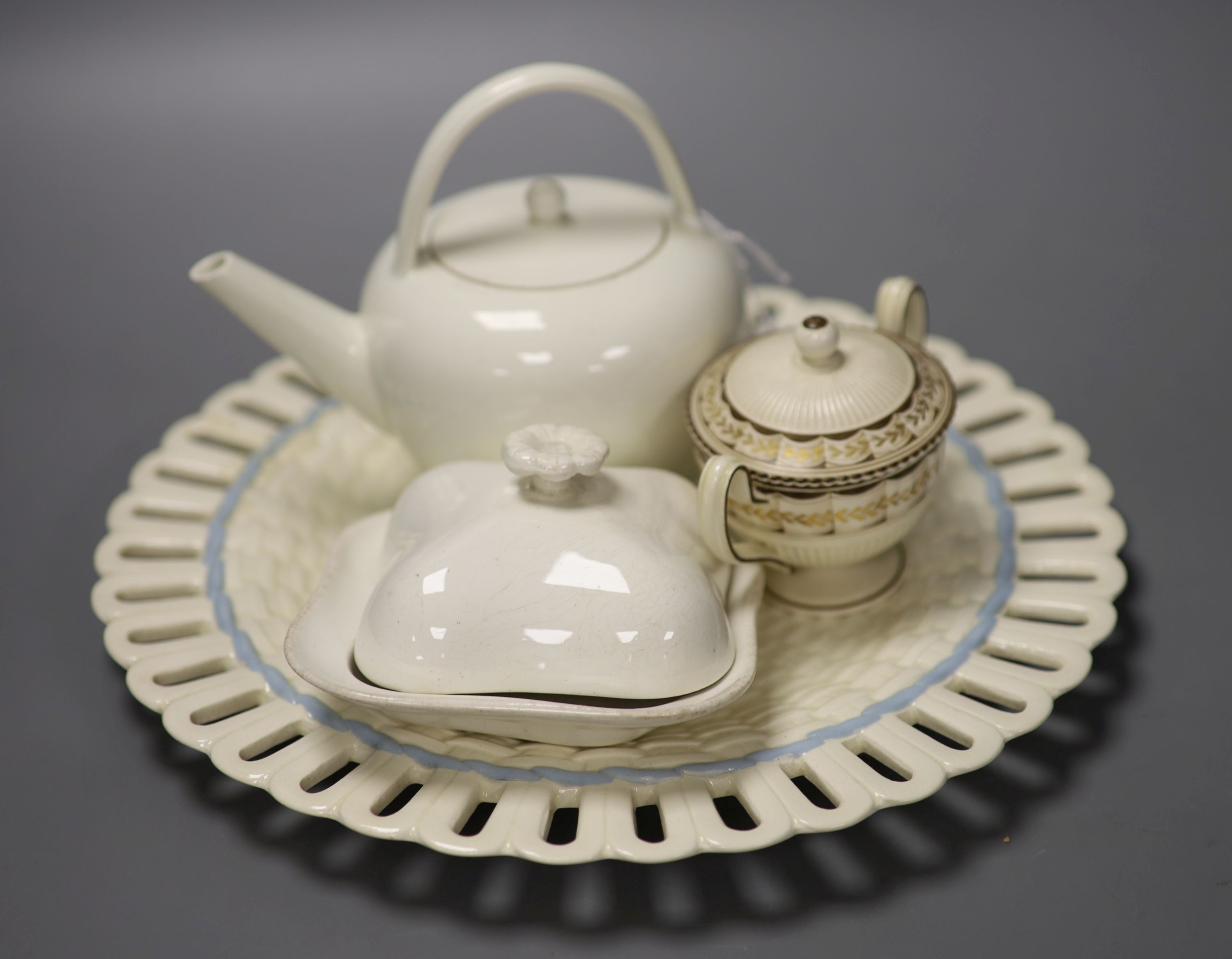 Four pieces of 19th century Wedgwood Queensware; a teapot, dish and cover and pot and cover together with a 20th century Queensware dis